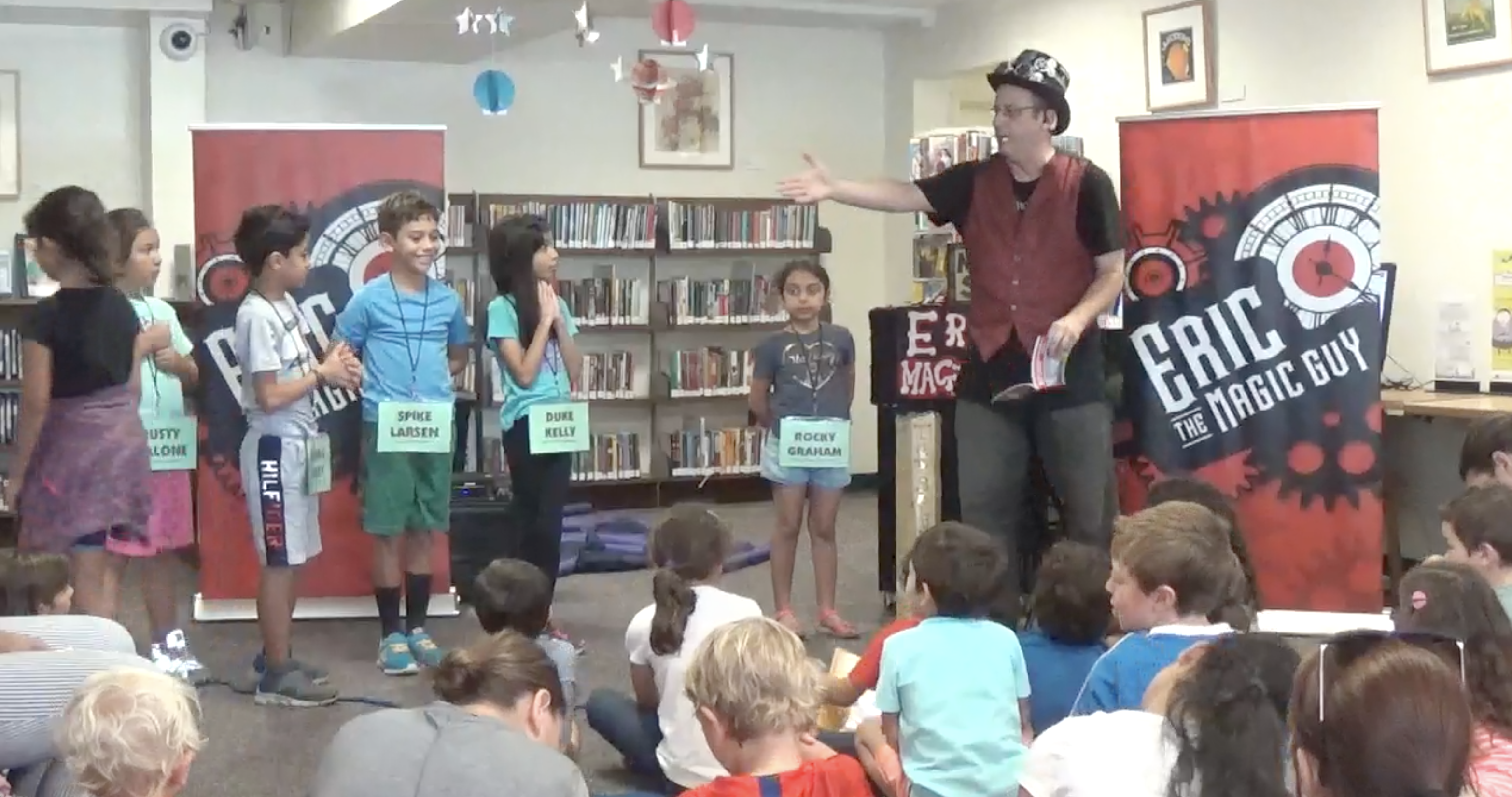 Eric performing magic at a library